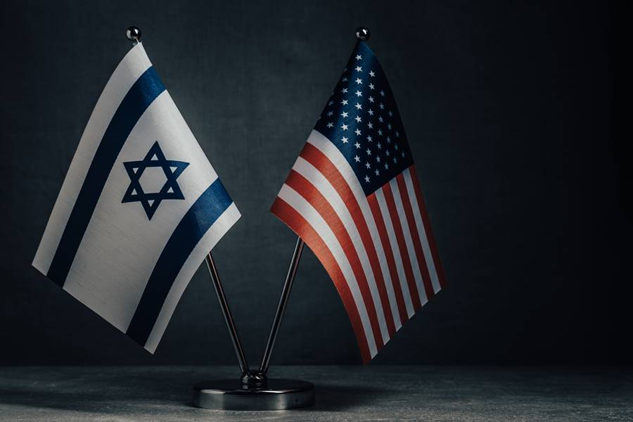 Table flag of United States America and Israel on dark background. Cooperation between two countries