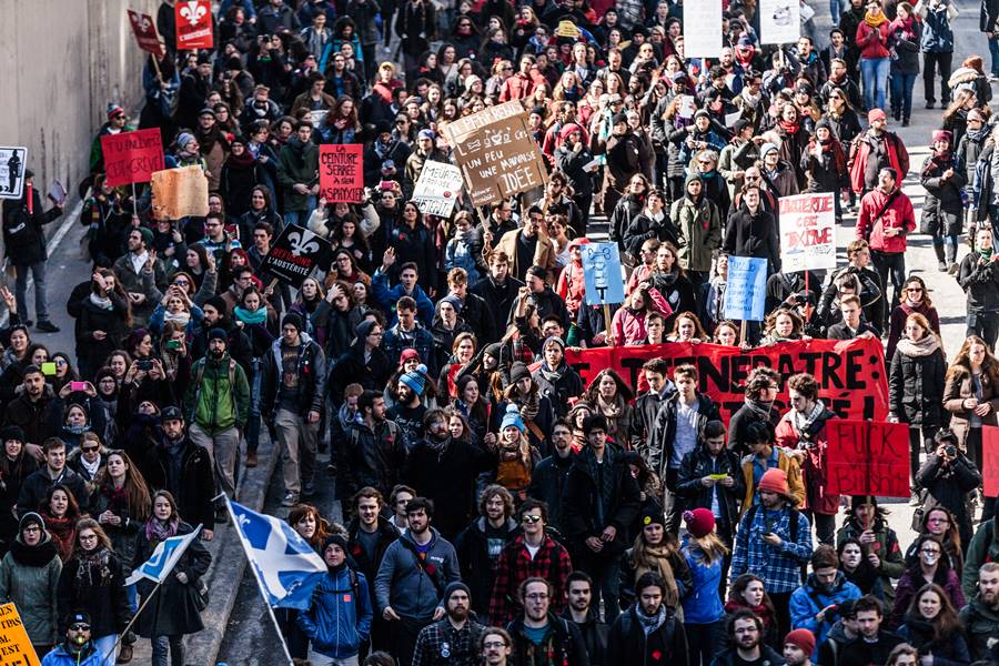 MONTREAL, CANADA, APRIL 02 2015. Riot in the Montreal Streets to counter the Economic Austerity Measures. Top View of the Protesters Walking in the Packed Streets