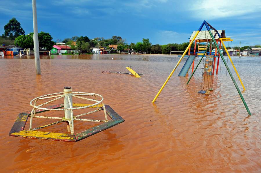 A shot of a playing yard flooded with water on a sunny day  in  Porto Alegre, Rio Grande do Sul, Brazil