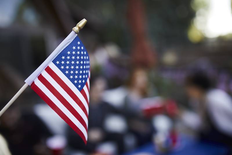 blurry-people-celebrating-with-american-flag