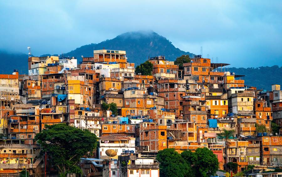 A beautiful view of a small town in the mountains during sunset in Brazil