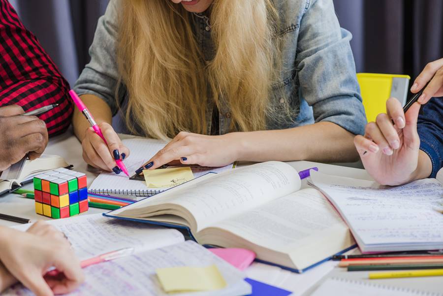 crop-people-studying-with-textbooks