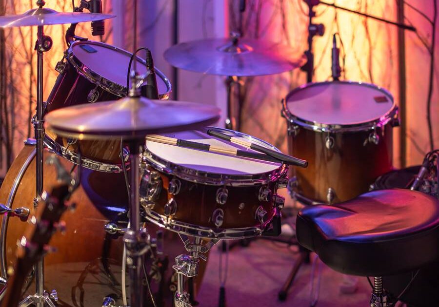 Drums, cymbals, hi hat on a beautiful background in the recording Studio. Room for musicians ' rehearsals. The concept of musical creativity and show business.