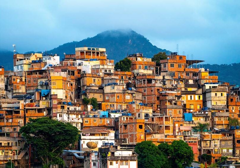 A beautiful view of a small town in the mountains during sunset in Brazil