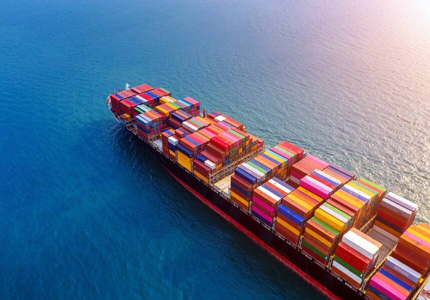 Aerial view of container cargo ship in sea.