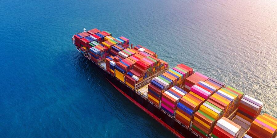 Aerial view of container cargo ship in sea.