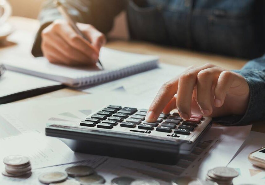 close up hand businesswoman using calculator for calculate finance accounting in office